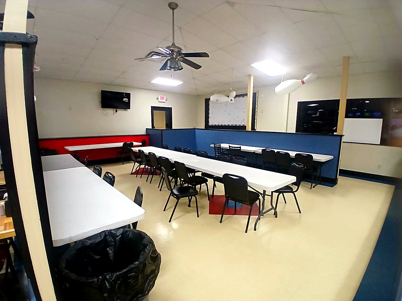 Party room set up for a birthday celebration at Artesia Lanes with table settings near the lanes